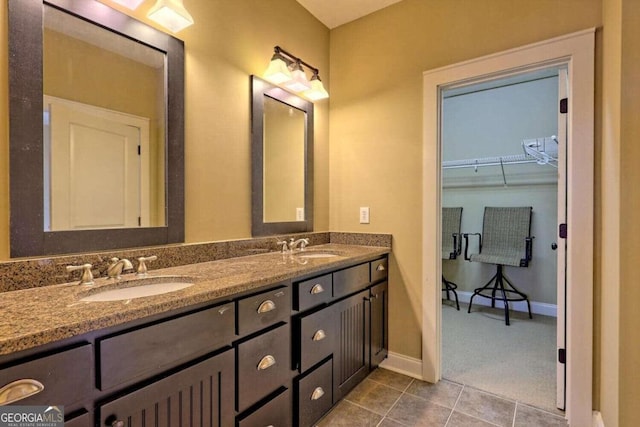 bathroom with tile patterned floors and vanity