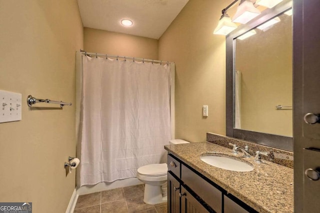 bathroom with vanity, toilet, curtained shower, and tile patterned floors