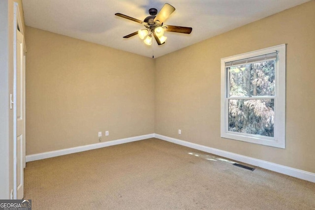 carpeted empty room with ceiling fan