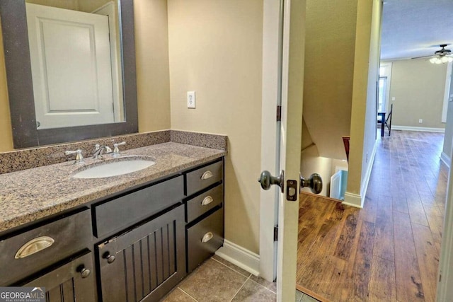 bathroom featuring vanity, wood-type flooring, and ceiling fan