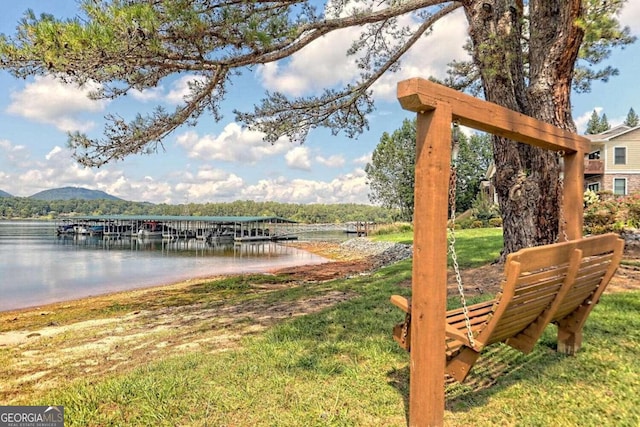 dock area featuring a water and mountain view