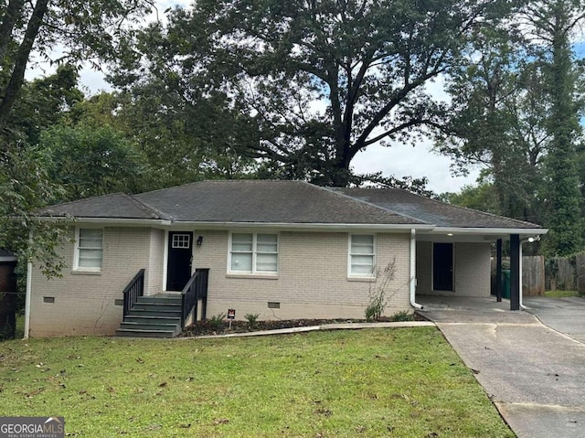 ranch-style house featuring a carport and a front yard