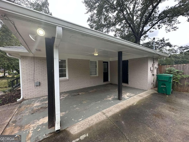 rear view of property featuring a carport