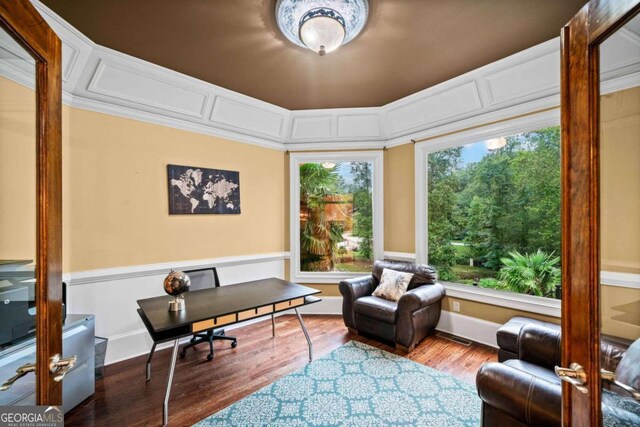 sitting room featuring french doors, hardwood / wood-style flooring, and crown molding