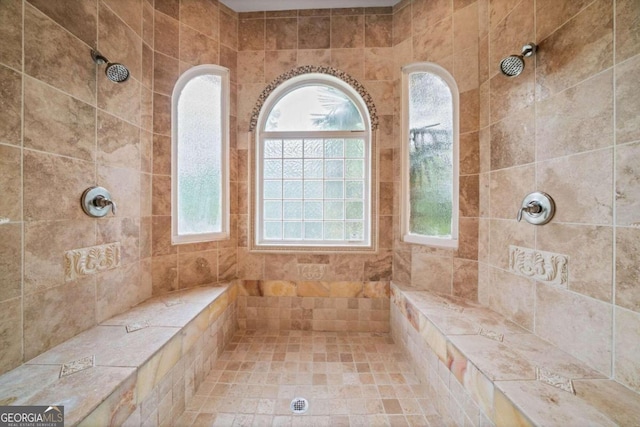 bathroom featuring a tile shower