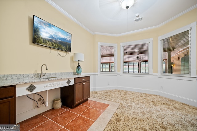 bathroom featuring crown molding, tile patterned flooring, and vanity