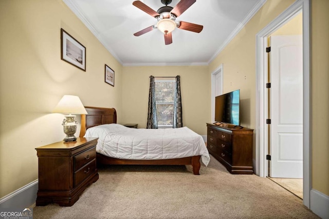 carpeted bedroom featuring ornamental molding and ceiling fan