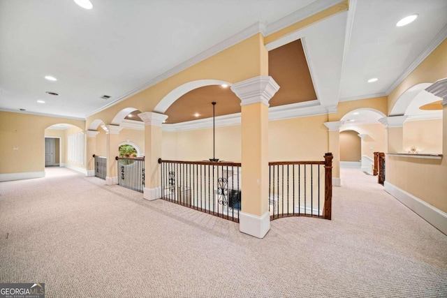 hall featuring ornamental molding and carpet