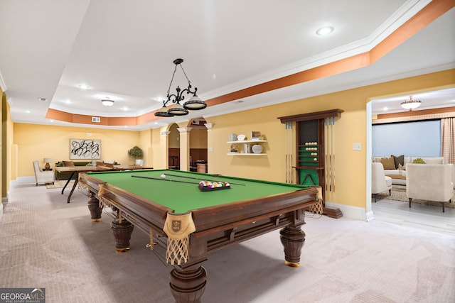 recreation room featuring light colored carpet, ornamental molding, a tray ceiling, and billiards