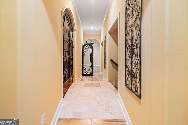 hall with ornamental molding and wood-type flooring