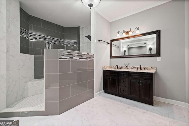 bathroom with ornamental molding, vanity, and a tile shower