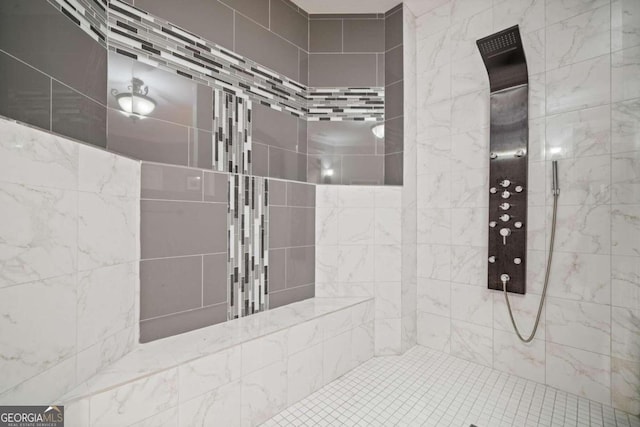 bathroom featuring tiled shower