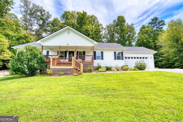 ranch-style house featuring a garage, covered porch, and a front lawn