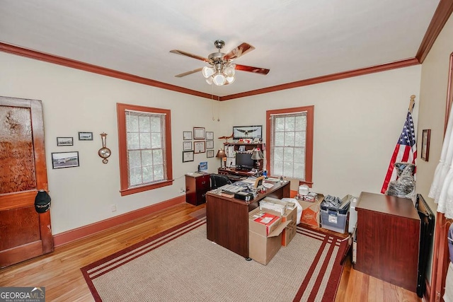 home office featuring light hardwood / wood-style floors, ceiling fan, and crown molding