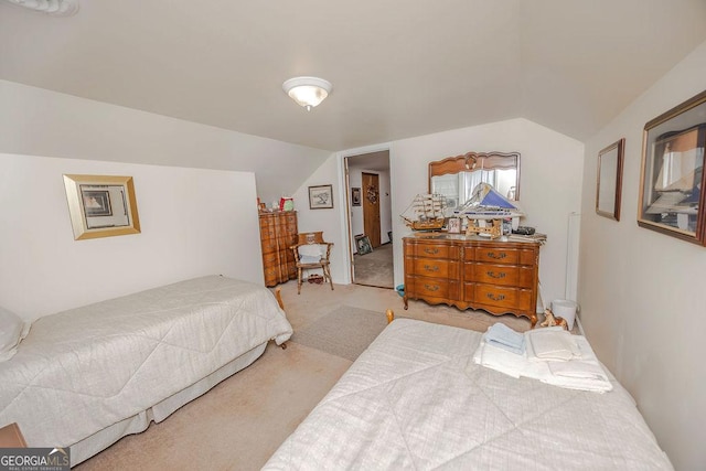 carpeted bedroom featuring vaulted ceiling