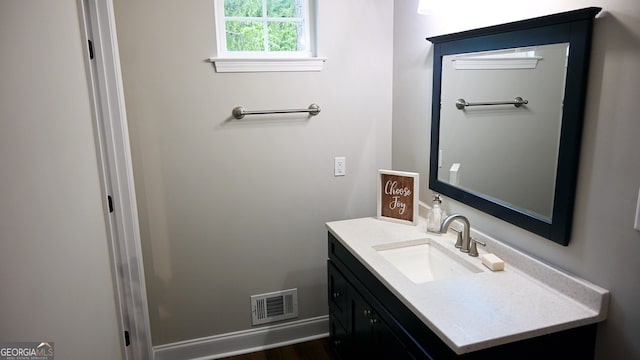 bathroom with wood-type flooring and vanity