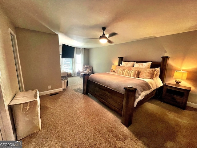 bedroom featuring ceiling fan and carpet flooring