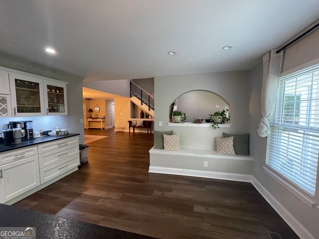 kitchen with dark hardwood / wood-style flooring and white cabinetry