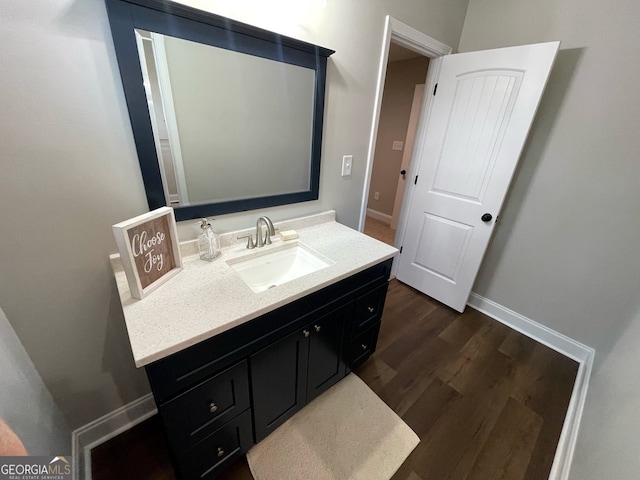 bathroom featuring vanity and wood-type flooring