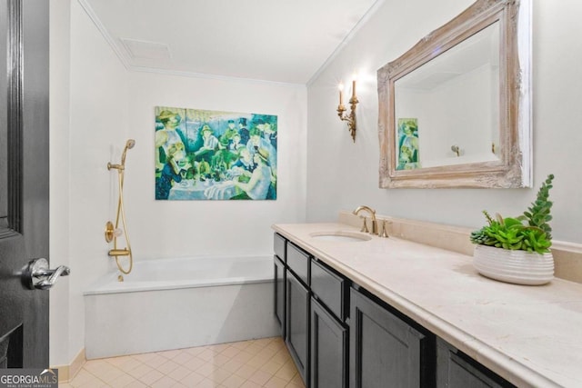 bathroom featuring crown molding, vanity, and a bathing tub