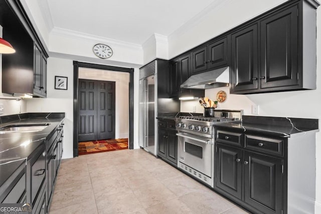 kitchen with premium appliances, sink, light tile patterned flooring, and ornamental molding