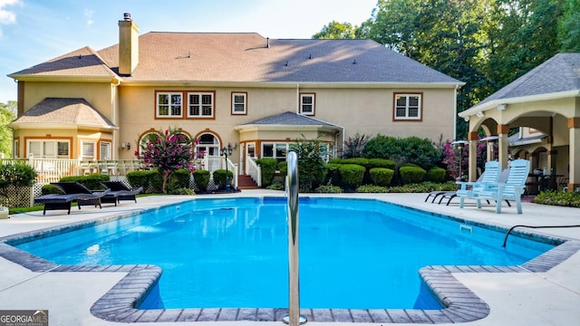 view of swimming pool with a patio