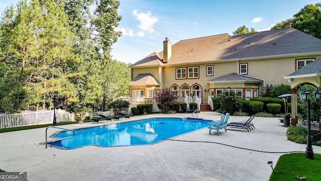 view of swimming pool featuring a patio