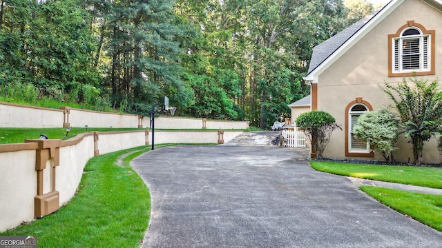 view of property exterior featuring a lawn