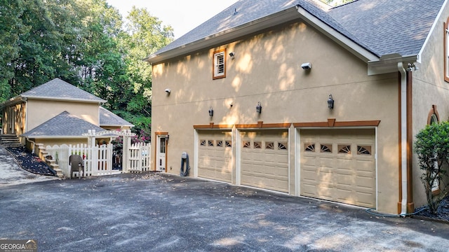 view of property exterior with a garage