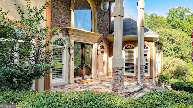 property entrance featuring french doors