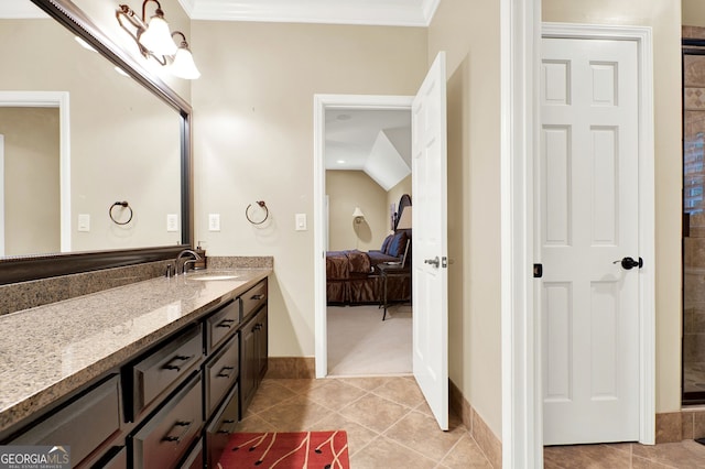 bathroom with ornamental molding, tile patterned floors, and vanity