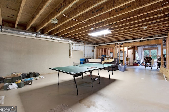 recreation room featuring concrete floors