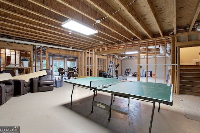 recreation room featuring concrete floors