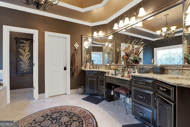 bathroom with tile patterned floors, vanity, ornamental molding, a raised ceiling, and a notable chandelier