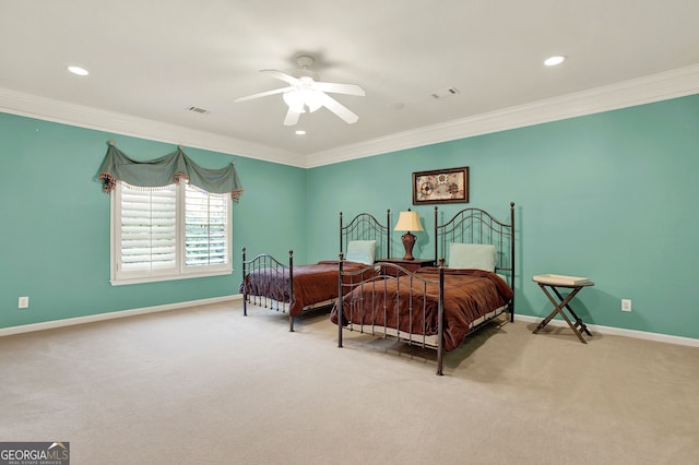 carpeted bedroom with ceiling fan and crown molding