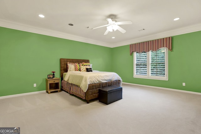 carpeted bedroom with ceiling fan and crown molding