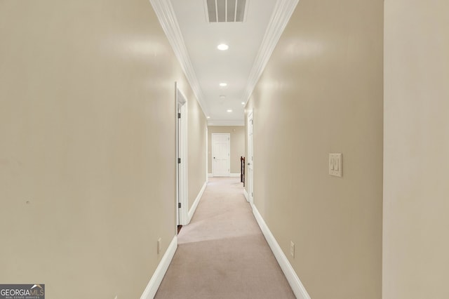 corridor with light colored carpet and ornamental molding