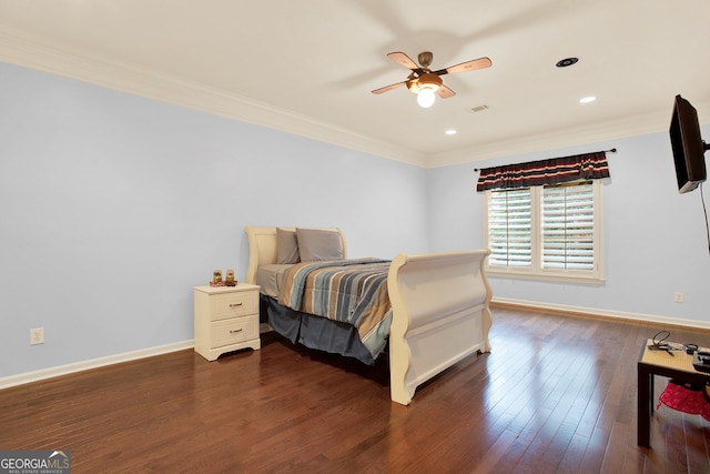 bedroom featuring ceiling fan, dark hardwood / wood-style flooring, and crown molding