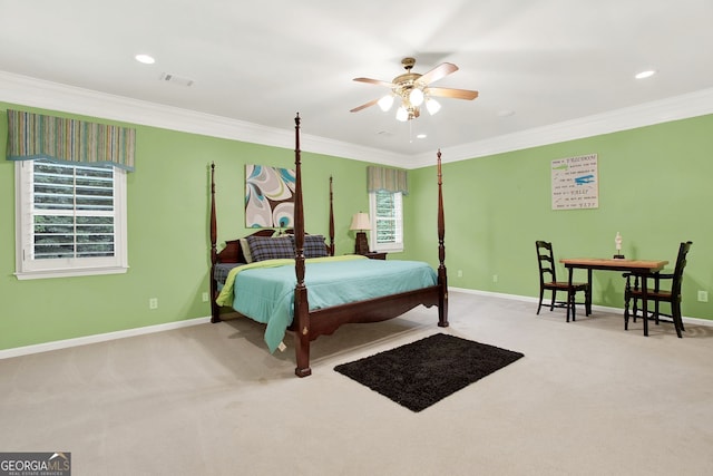 bedroom with ceiling fan, multiple windows, ornamental molding, and carpet flooring