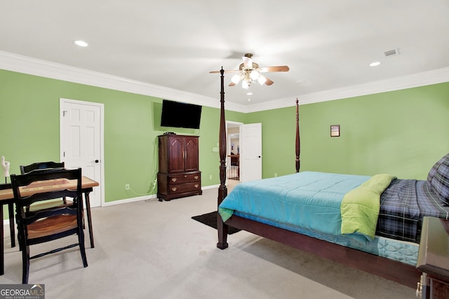 carpeted bedroom with ceiling fan and ornamental molding