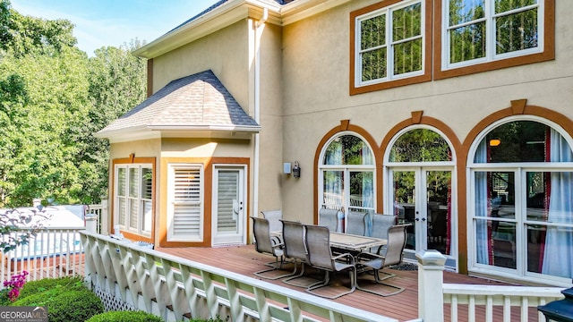 wooden deck featuring french doors