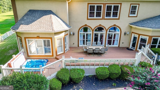 rear view of property with a deck