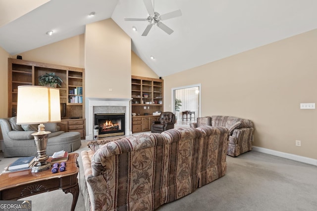 living room with built in shelves, ceiling fan, light carpet, and high vaulted ceiling