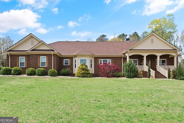 single story home featuring a porch and a front lawn