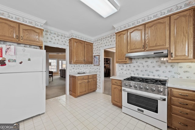 kitchen with light carpet, white appliances, and crown molding