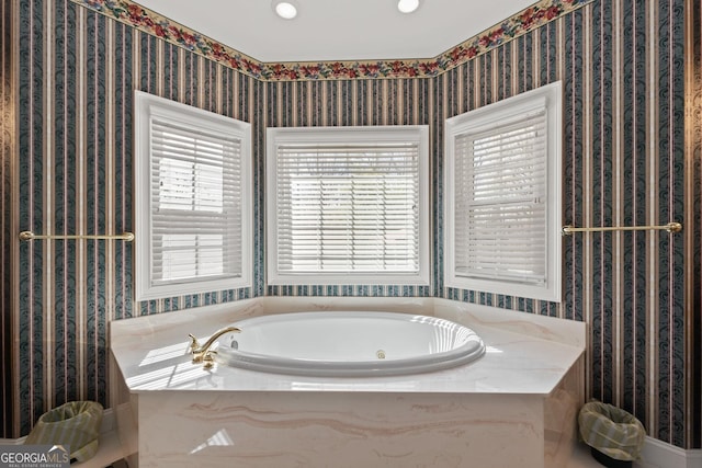 bathroom featuring tiled bath