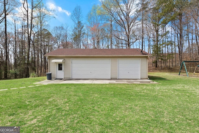 garage with a lawn