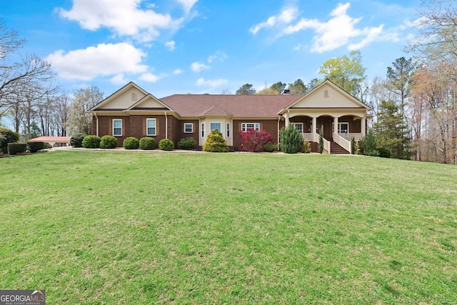 ranch-style house with a porch and a front lawn