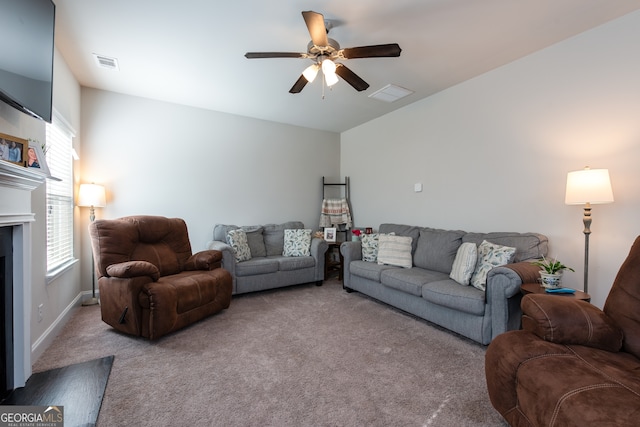 carpeted living room featuring ceiling fan