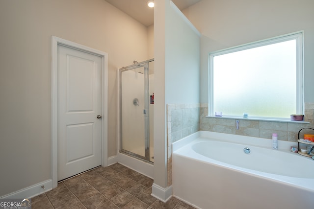 bathroom featuring tile patterned floors and plus walk in shower